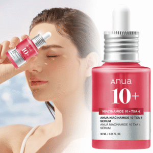 Model applying Anua Red Serum for dark spot correction and glowing skin